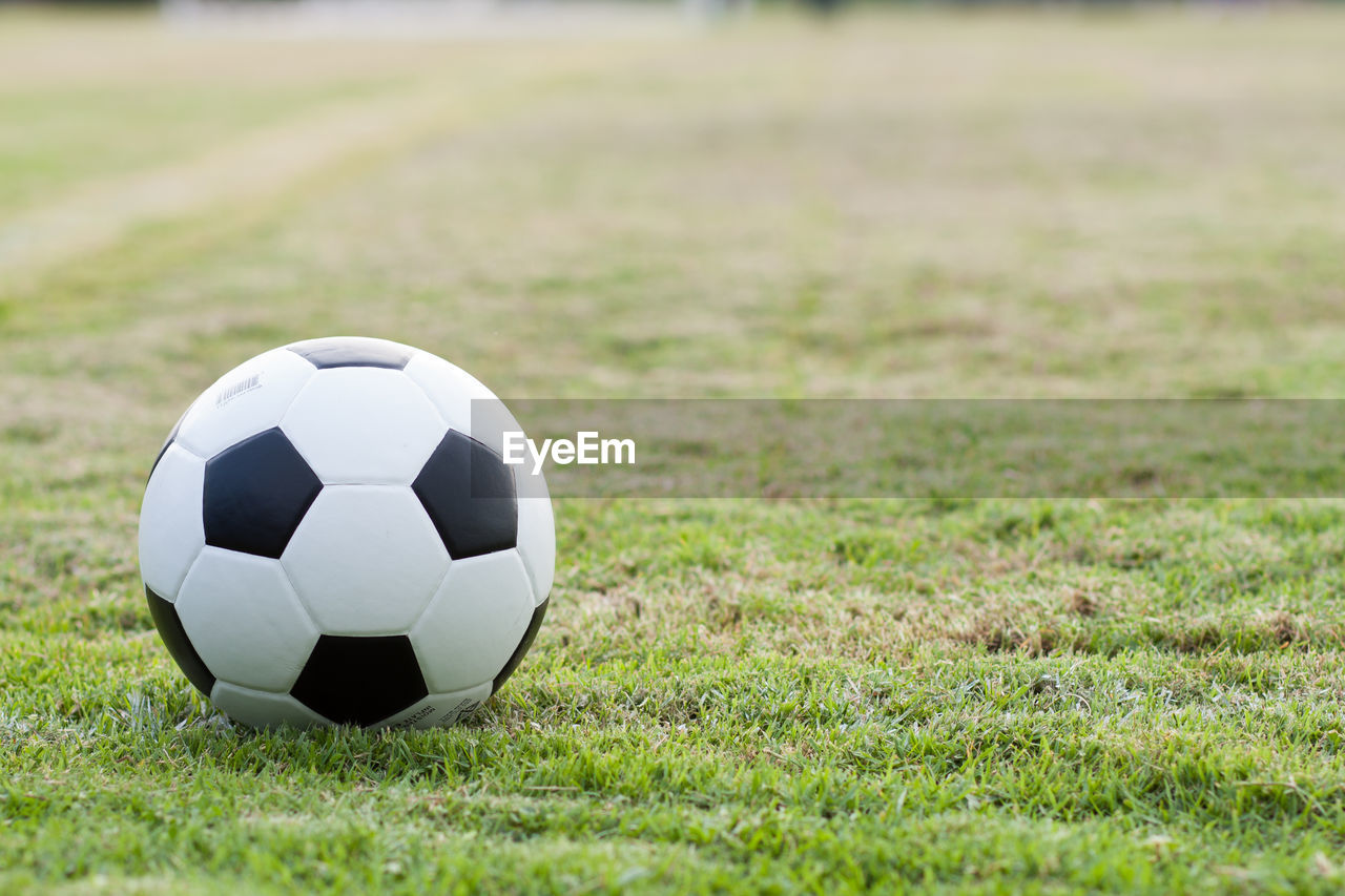 Close-up of soccer ball on playing field