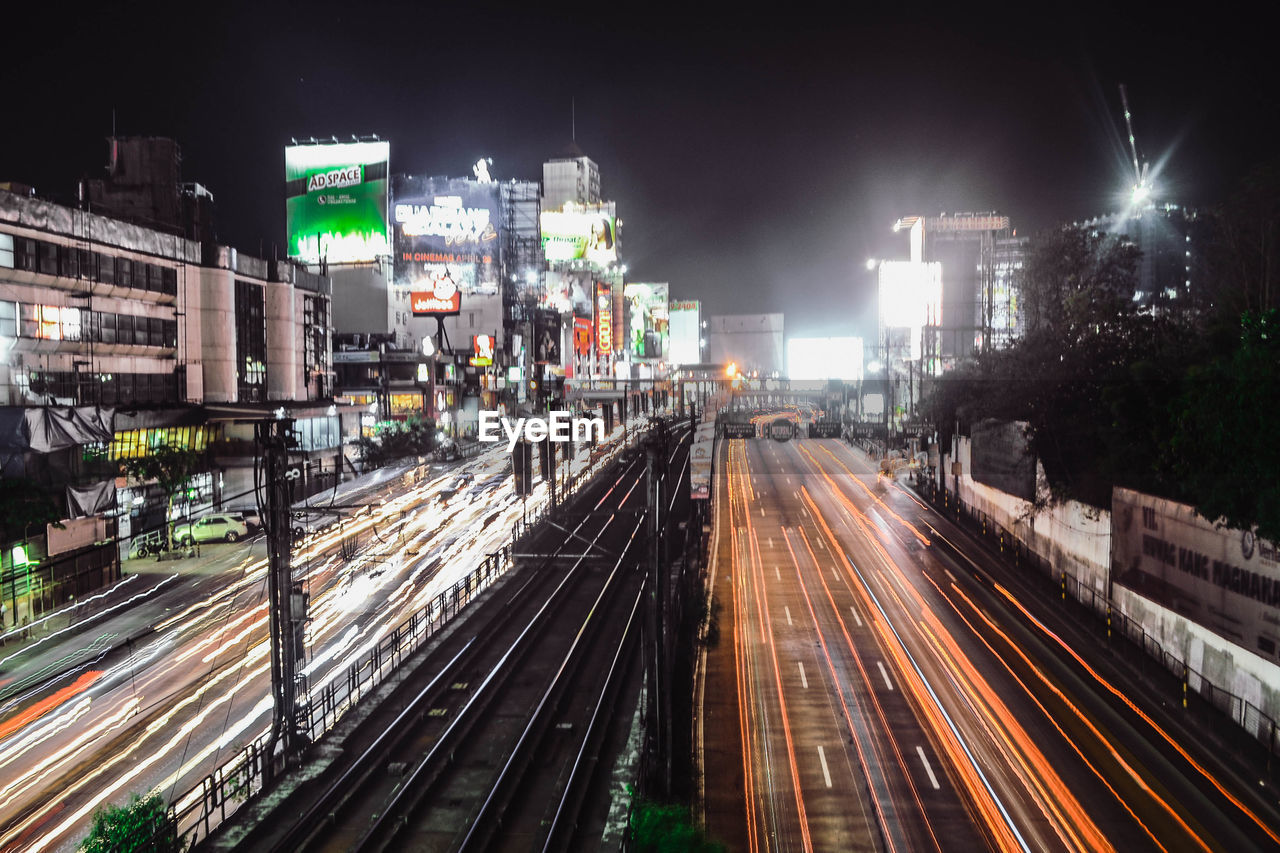 High angle view of light trails in city at night