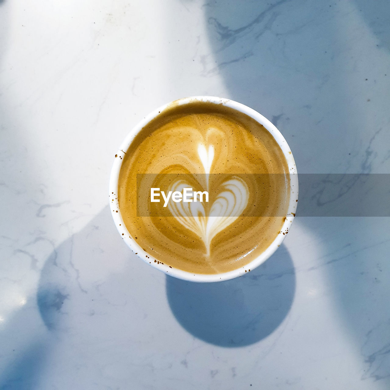 CLOSE-UP OF COFFEE ON TABLE