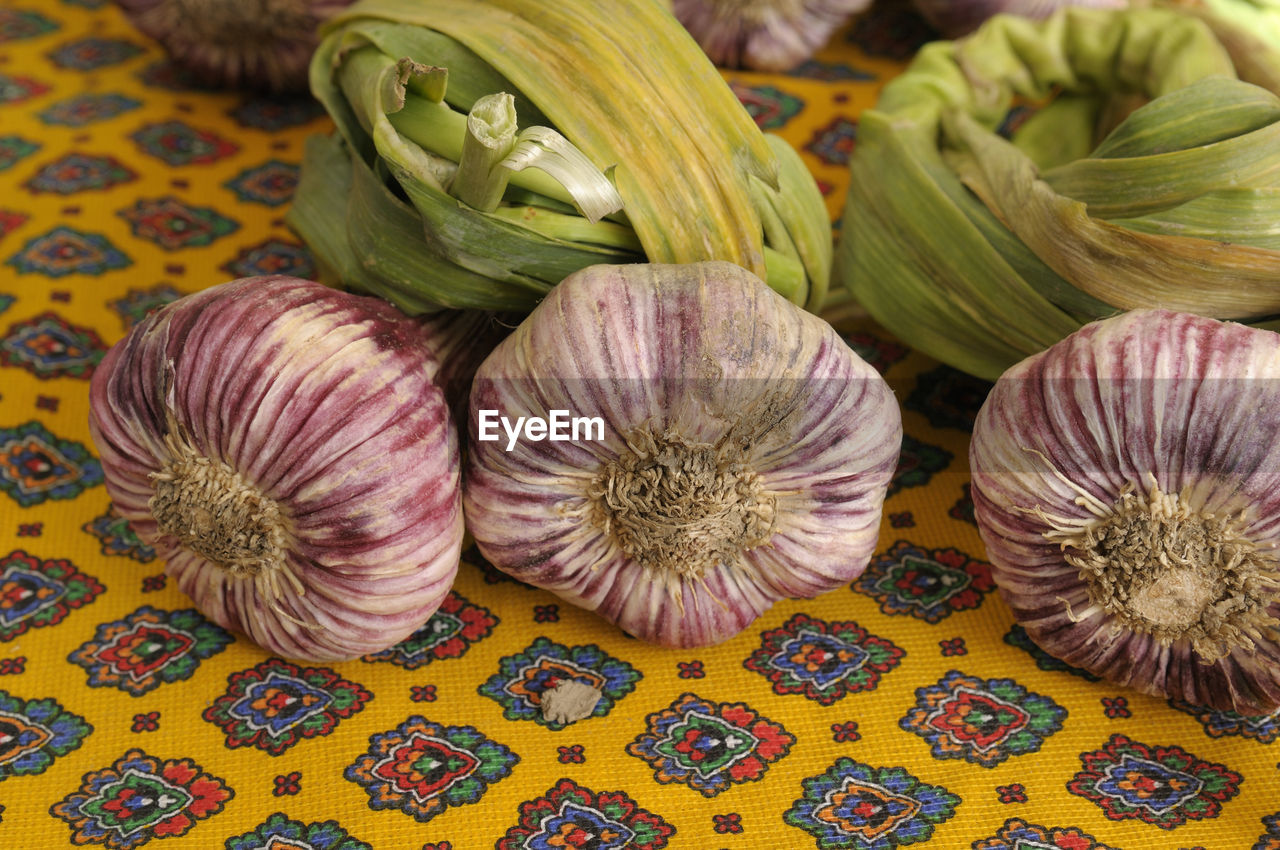 HIGH ANGLE VIEW OF VARIOUS VEGETABLES IN CONTAINER