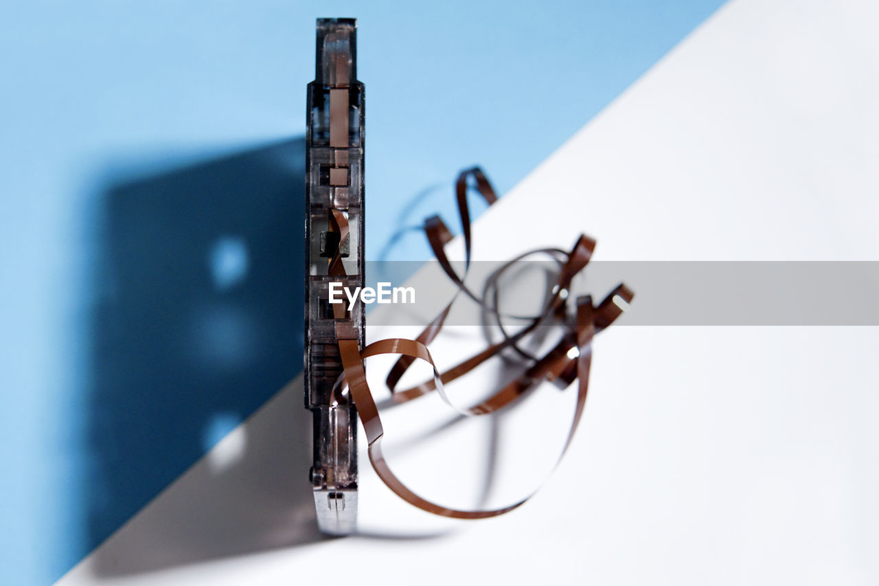 Close-up of damaged audio cassette on table