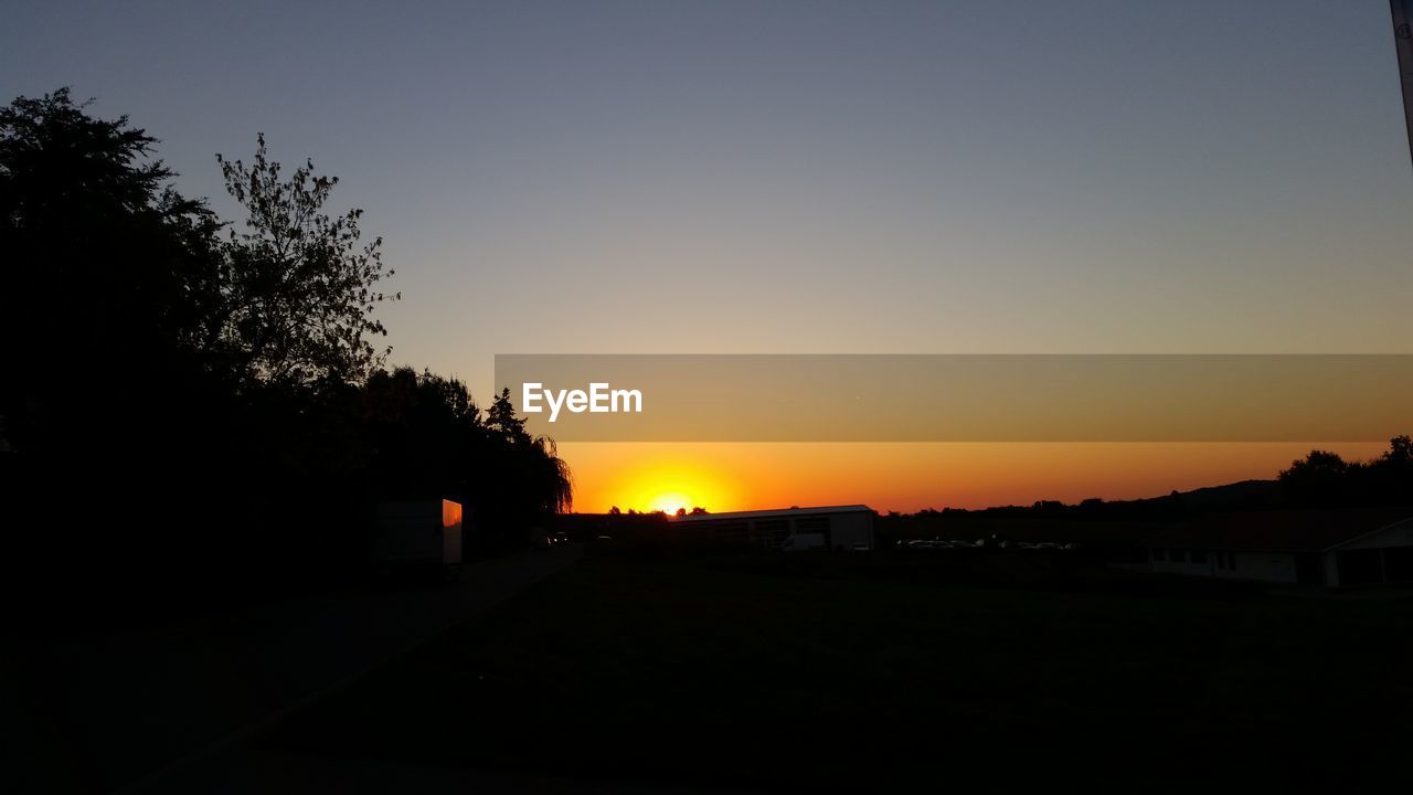 SILHOUETTE OF LANDSCAPE AT SUNSET