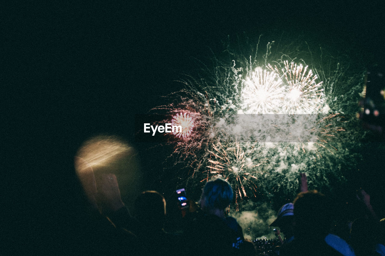 FIREWORK DISPLAY AT NIGHT DURING FESTIVAL