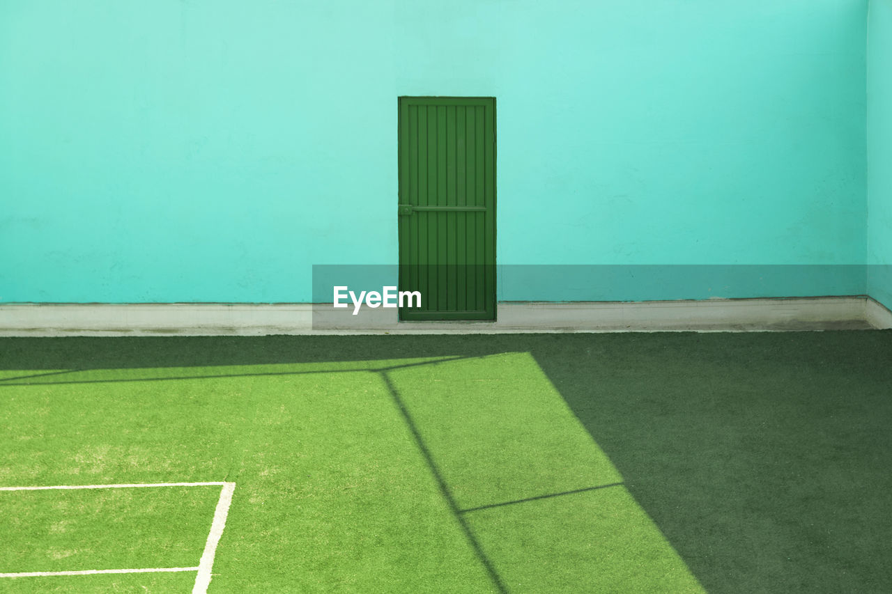 Tennis court against building