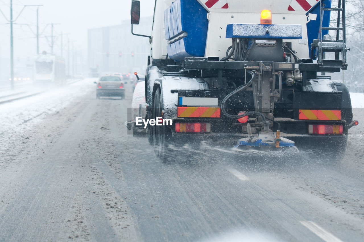 CARS ON STREET IN WINTER