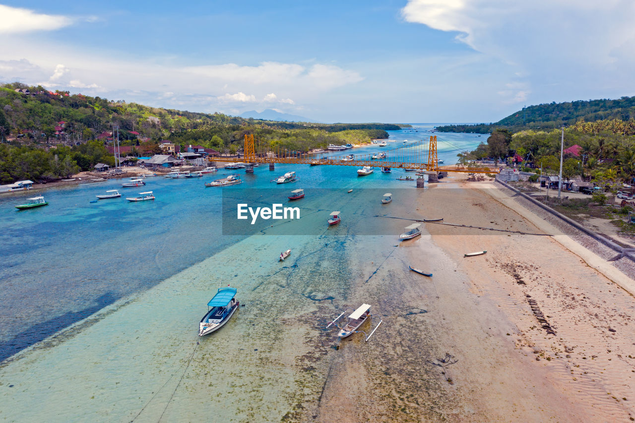 SCENIC VIEW OF BEACH AGAINST BLUE SKY