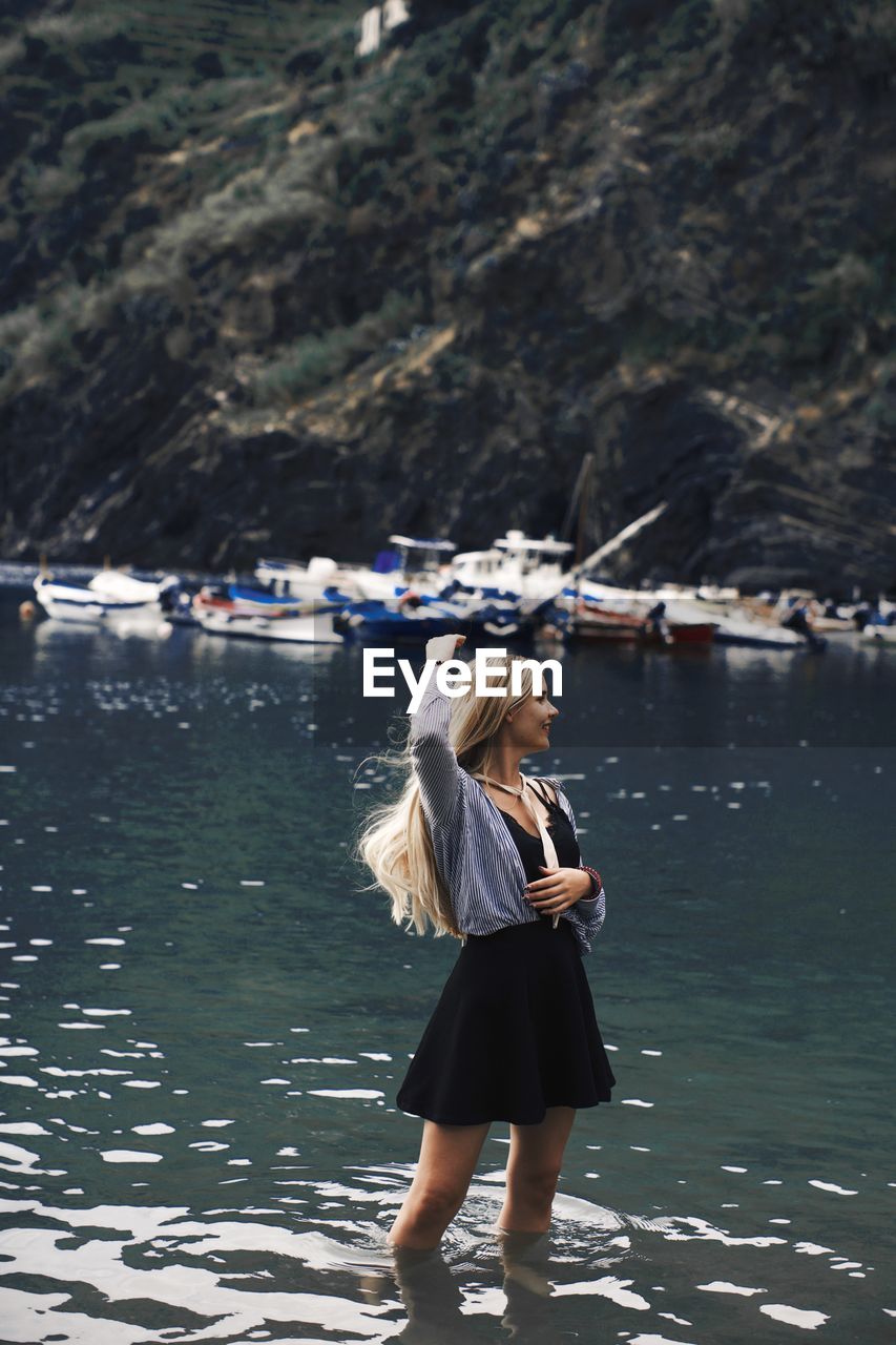 Woman standing in lake