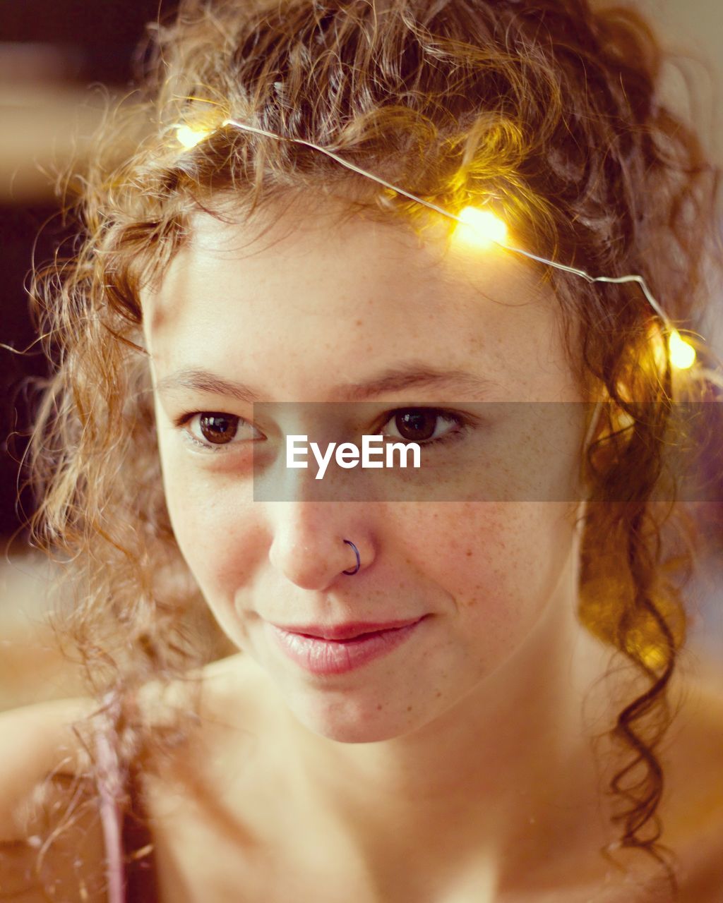 Close-up portrait of a smiling young woman