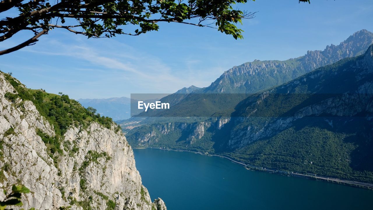 Scenic view of lake and mountains against sky