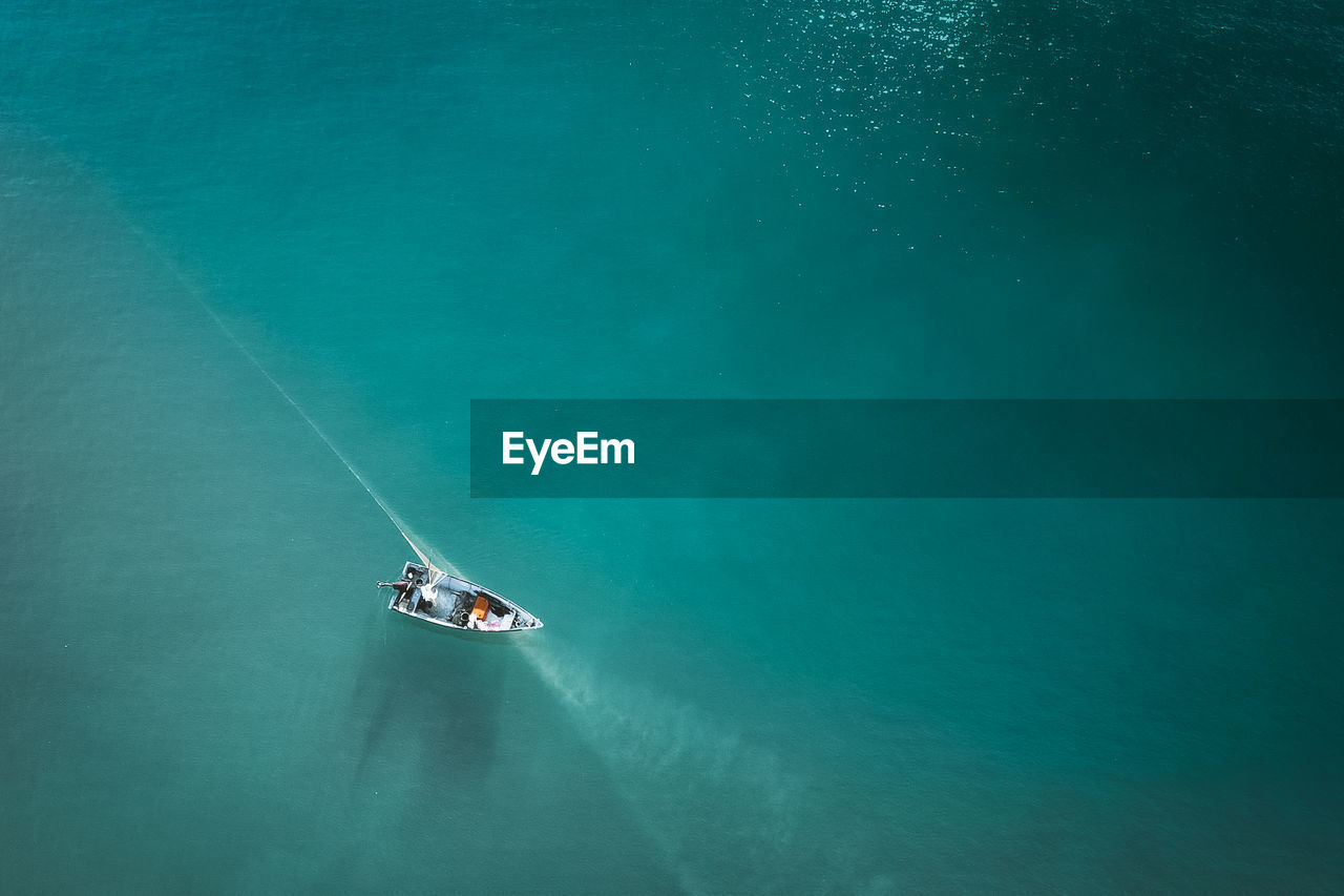 High angle view of boat sailing on sea