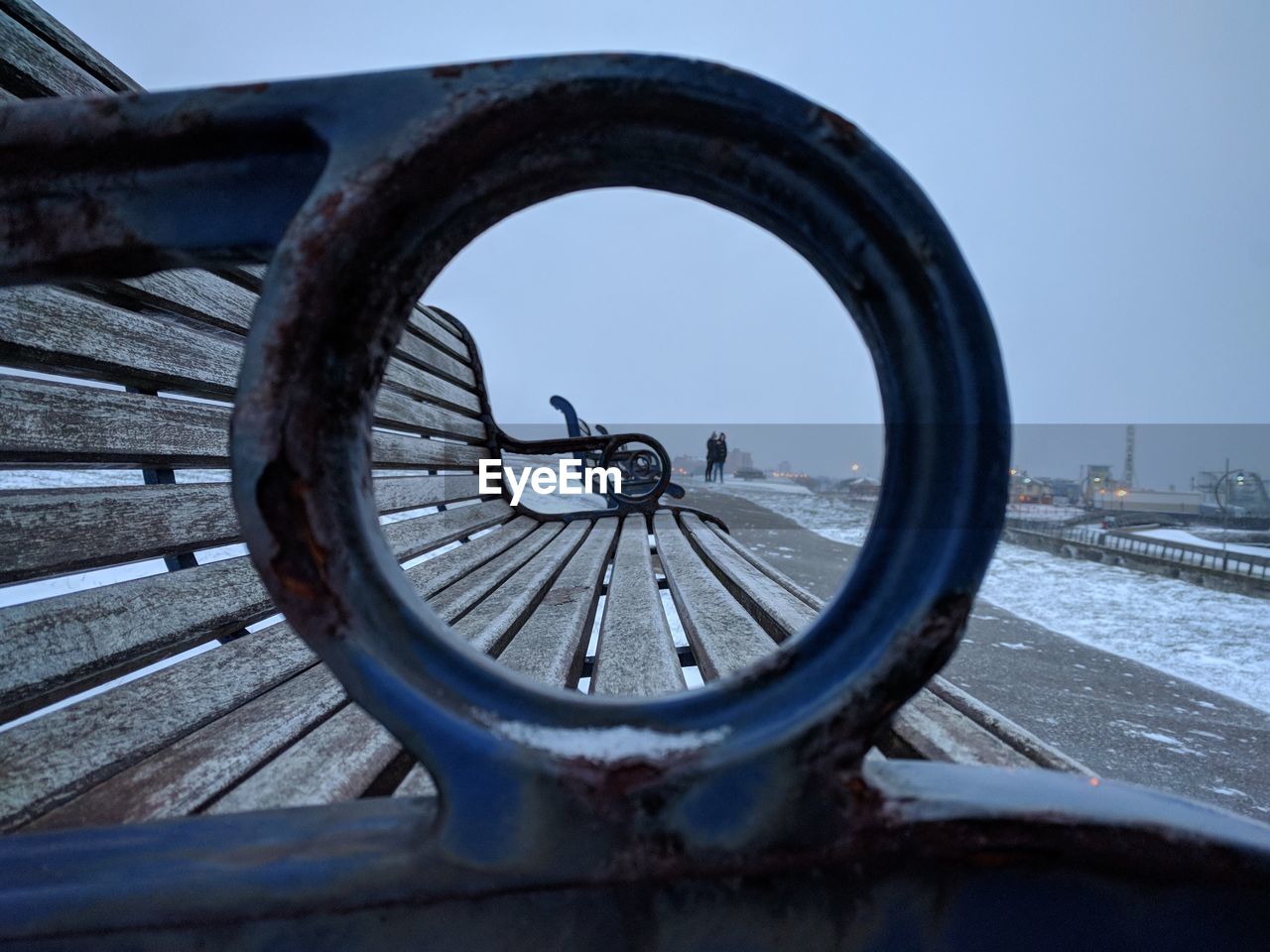 Close-up of bench at beach