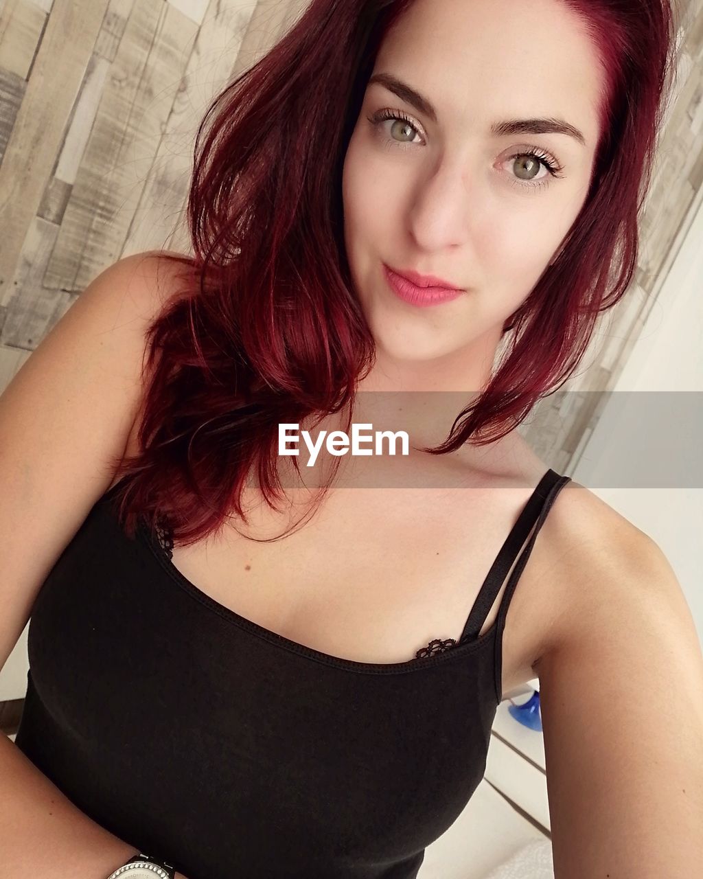Portrait of beautiful young woman at home