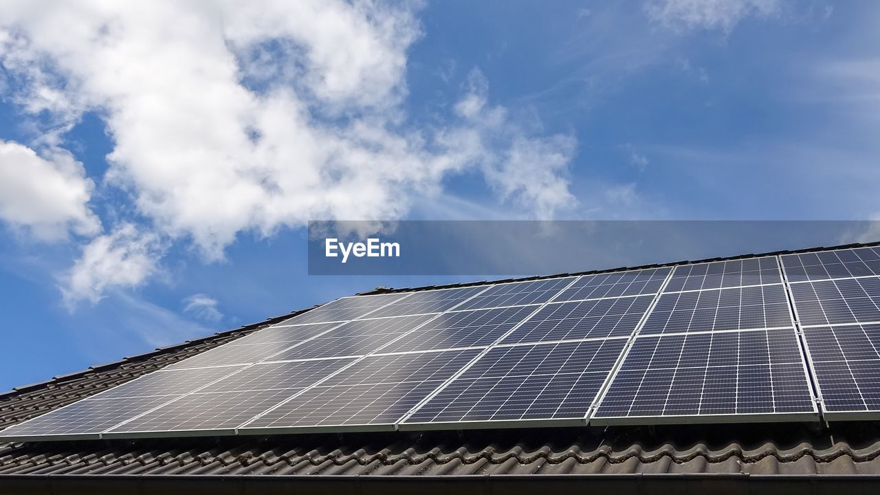 Solar panels producing clean energy on a roof of a residential house