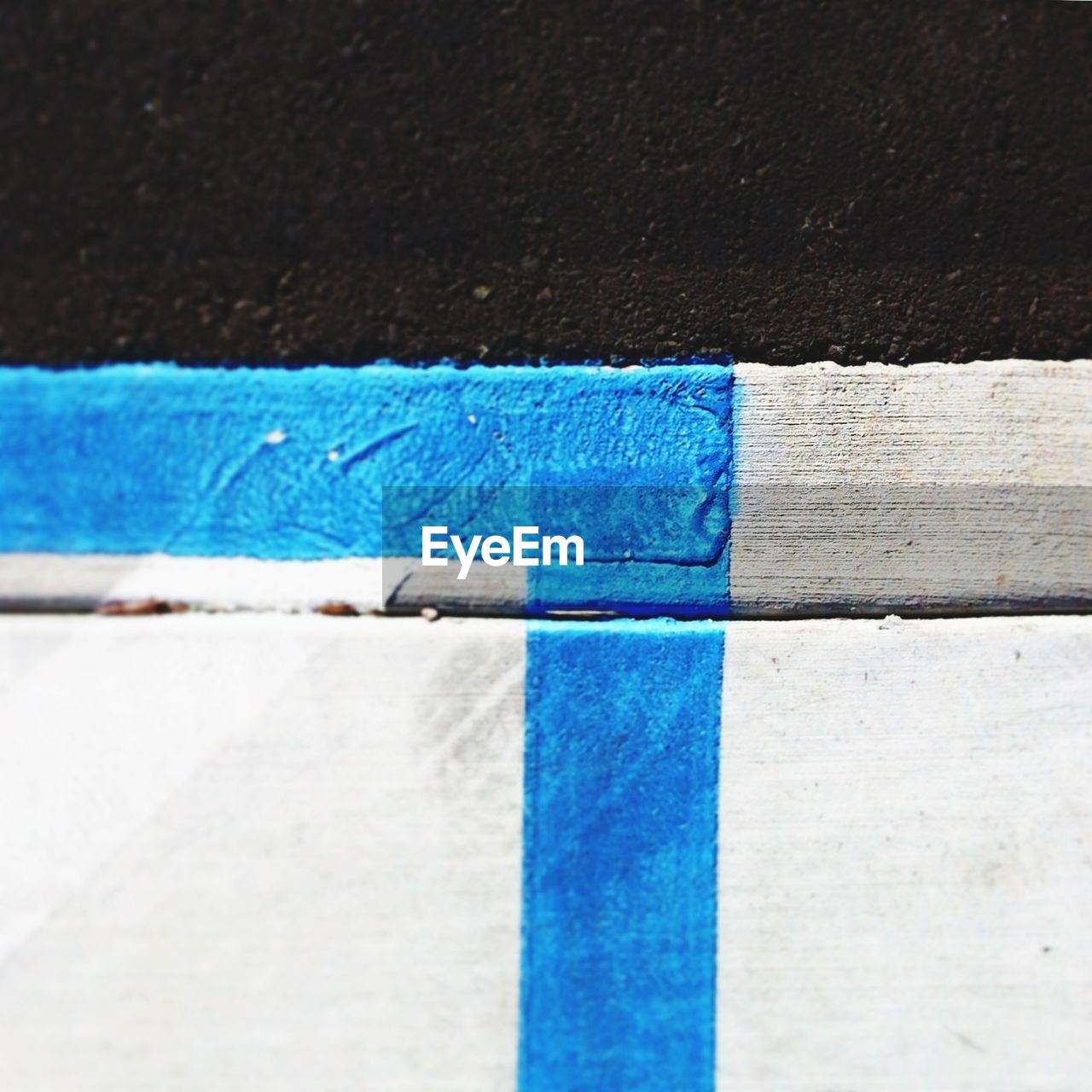 CLOSE-UP OF MULTI COLORED WALL