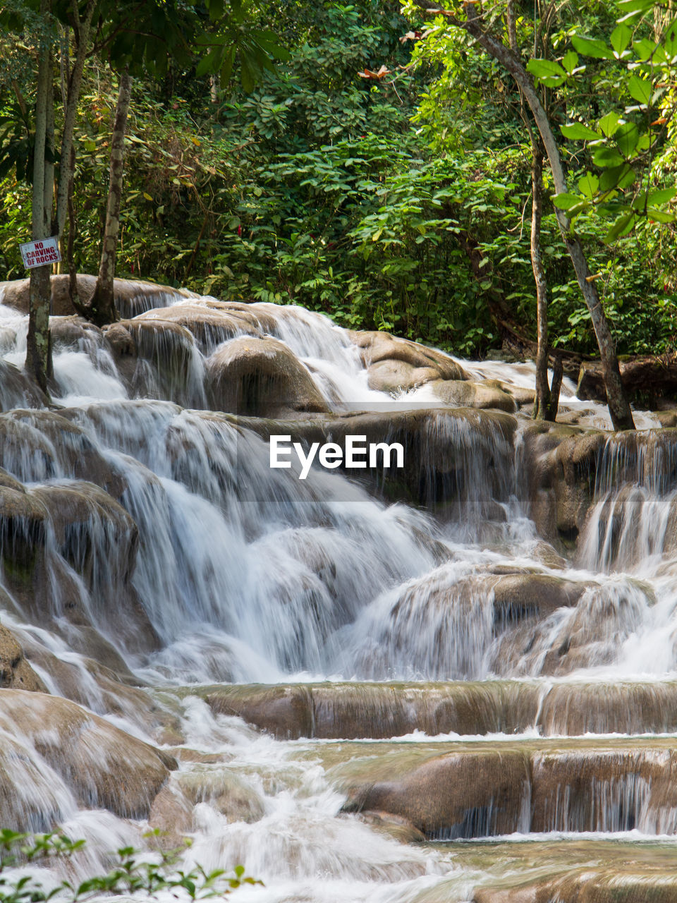 SCENIC VIEW OF RIVER FLOWING THROUGH ROCKS