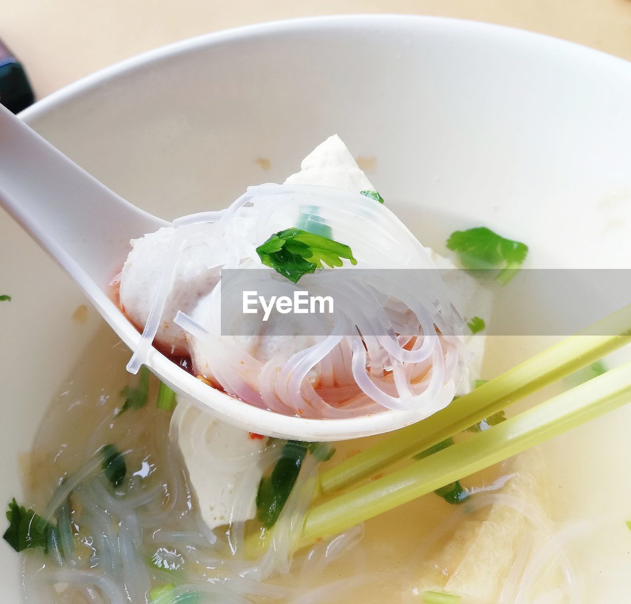 CLOSE-UP OF SOUP IN BOWL ON TABLE