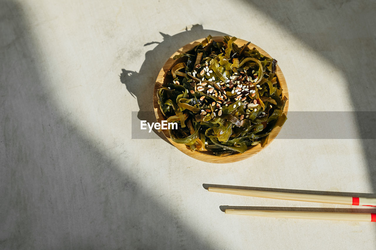 HIGH ANGLE VIEW OF FOOD IN GLASS ON TABLE