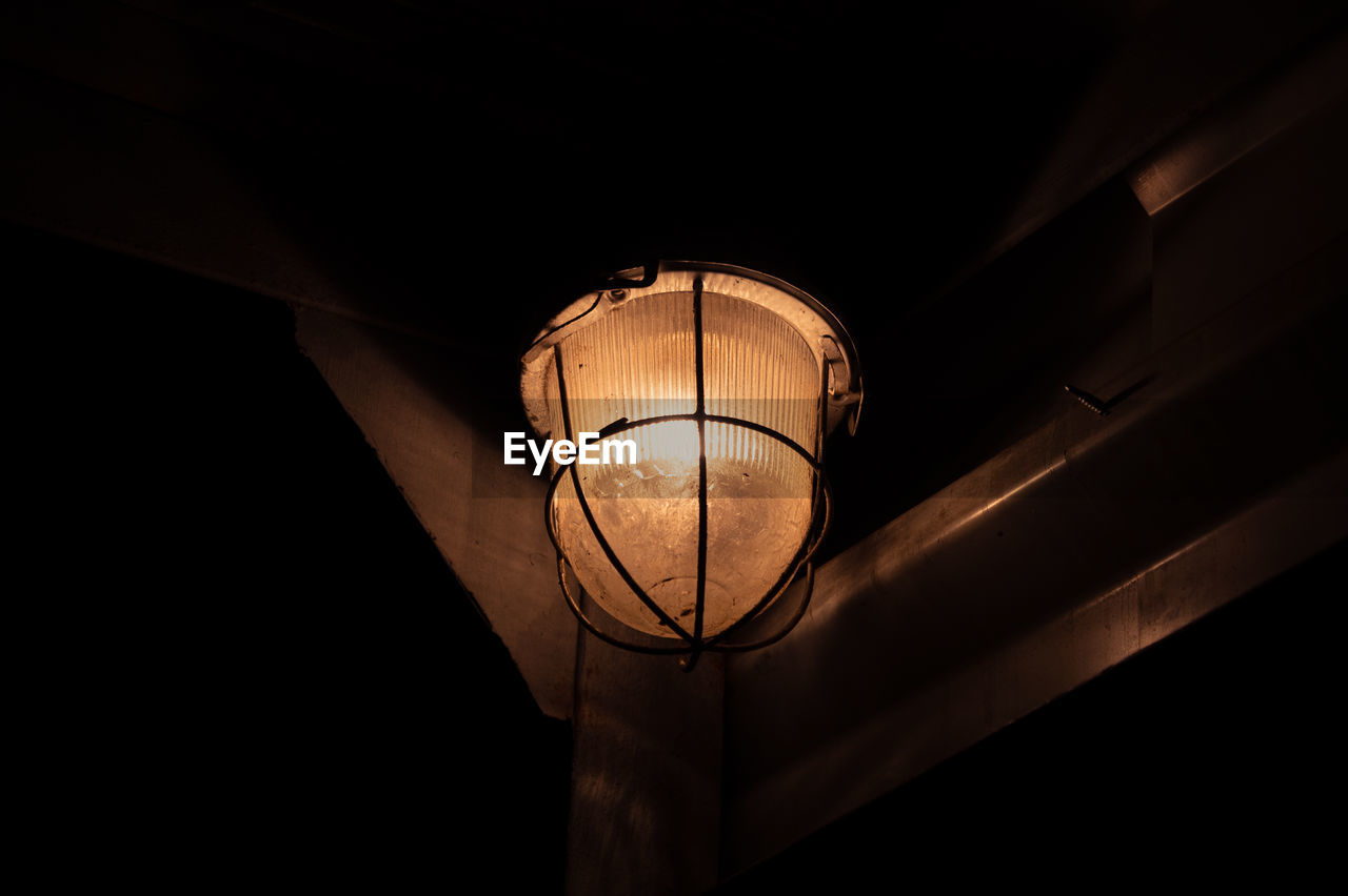 Low angle view of illuminated light bulb
