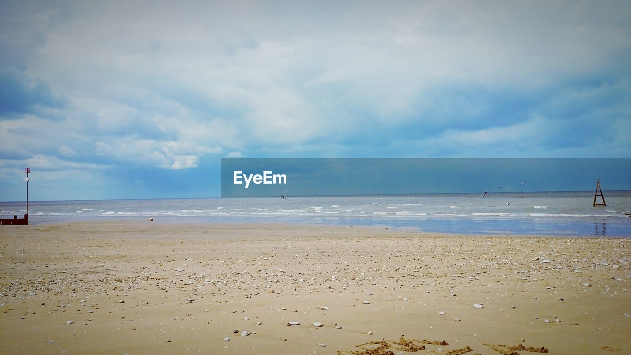 Scenic view of beach against sky