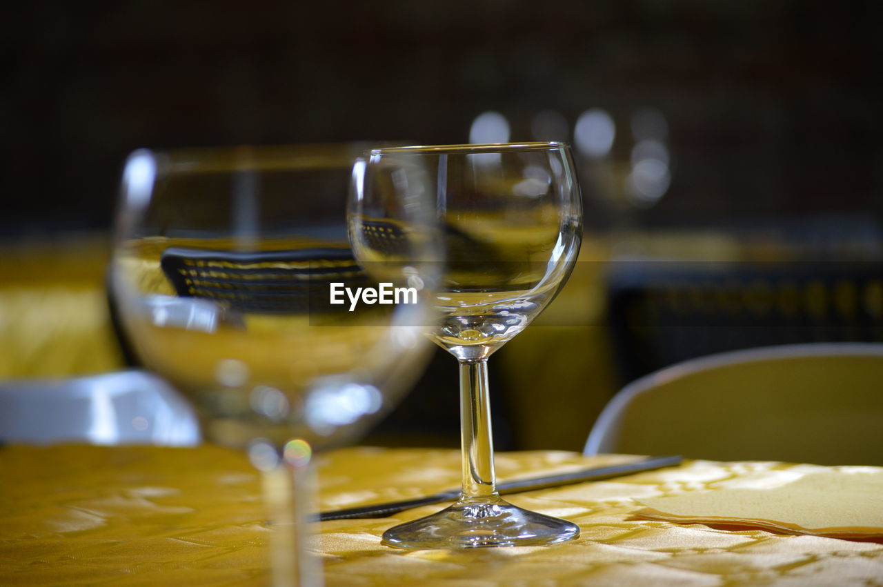 Close-up of empty wineglass on table