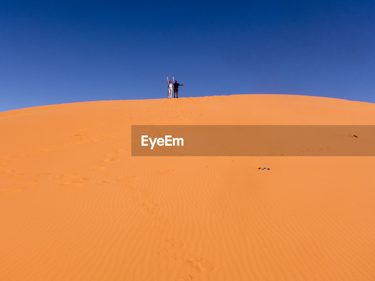 Scenic view of desert against clear sky