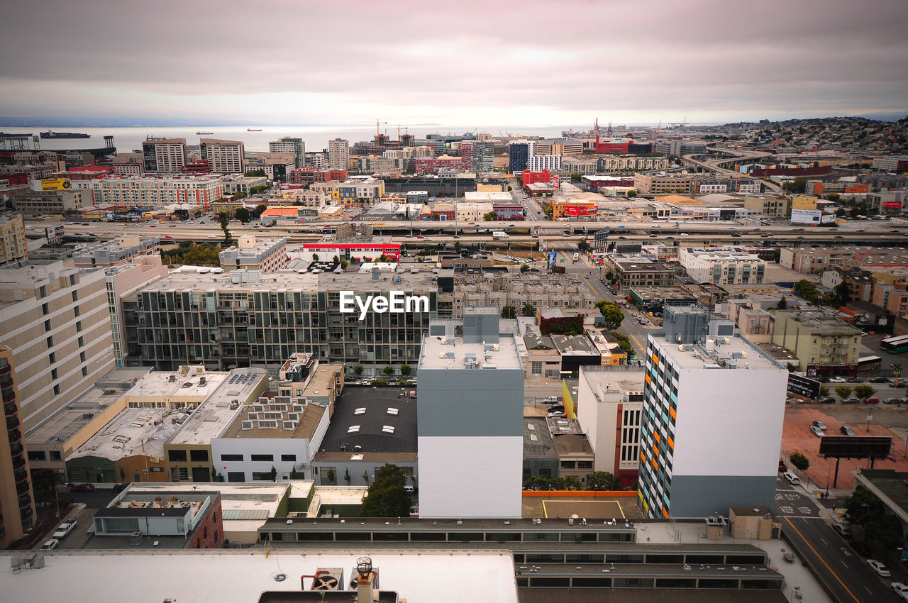 High angle view of buildings in city against sky