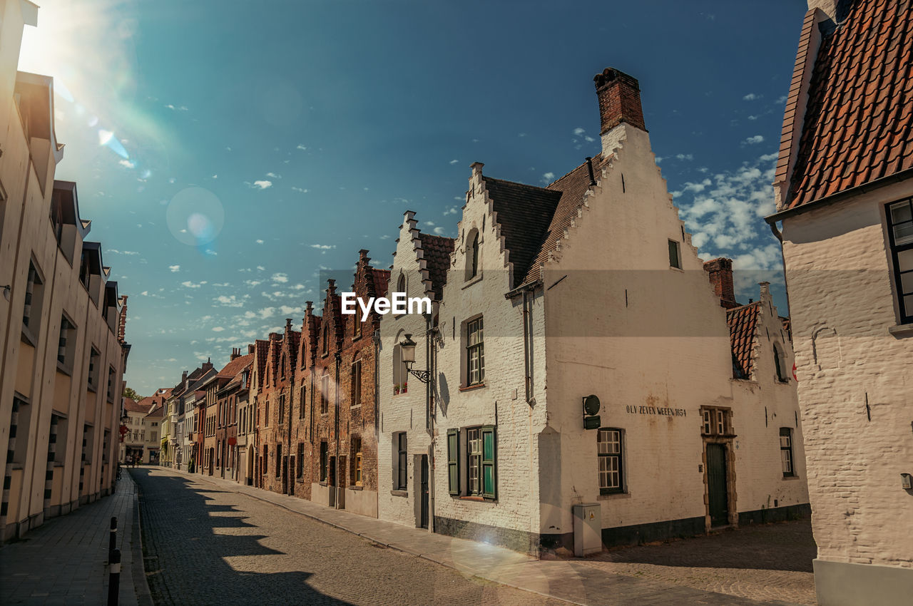 Facade of old houses in street of bruges. a town full of canals and old buildings in belgium.