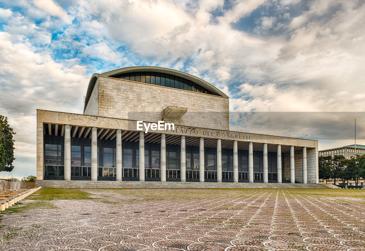 Palazzo dei congressi against cloudy sky