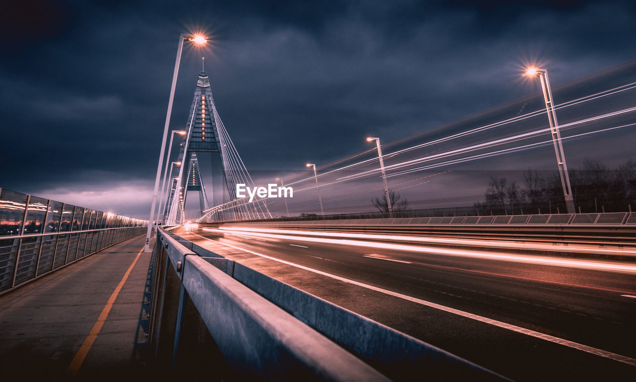 Light trails on suspension bridge at night