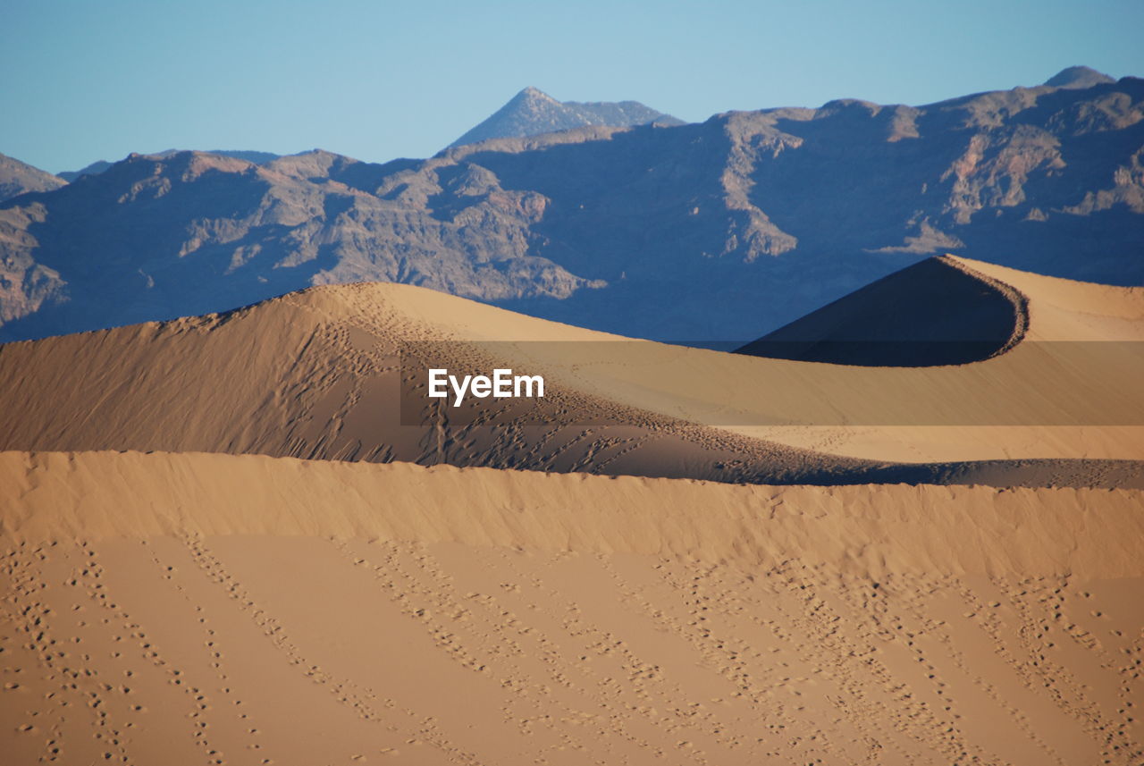 Scenic view of desert against clear sky