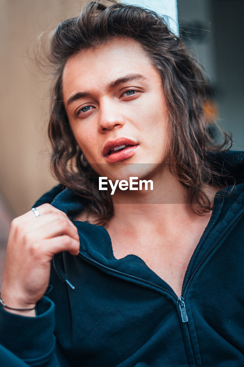 Portrait of young man wearing warm clothing outdoors