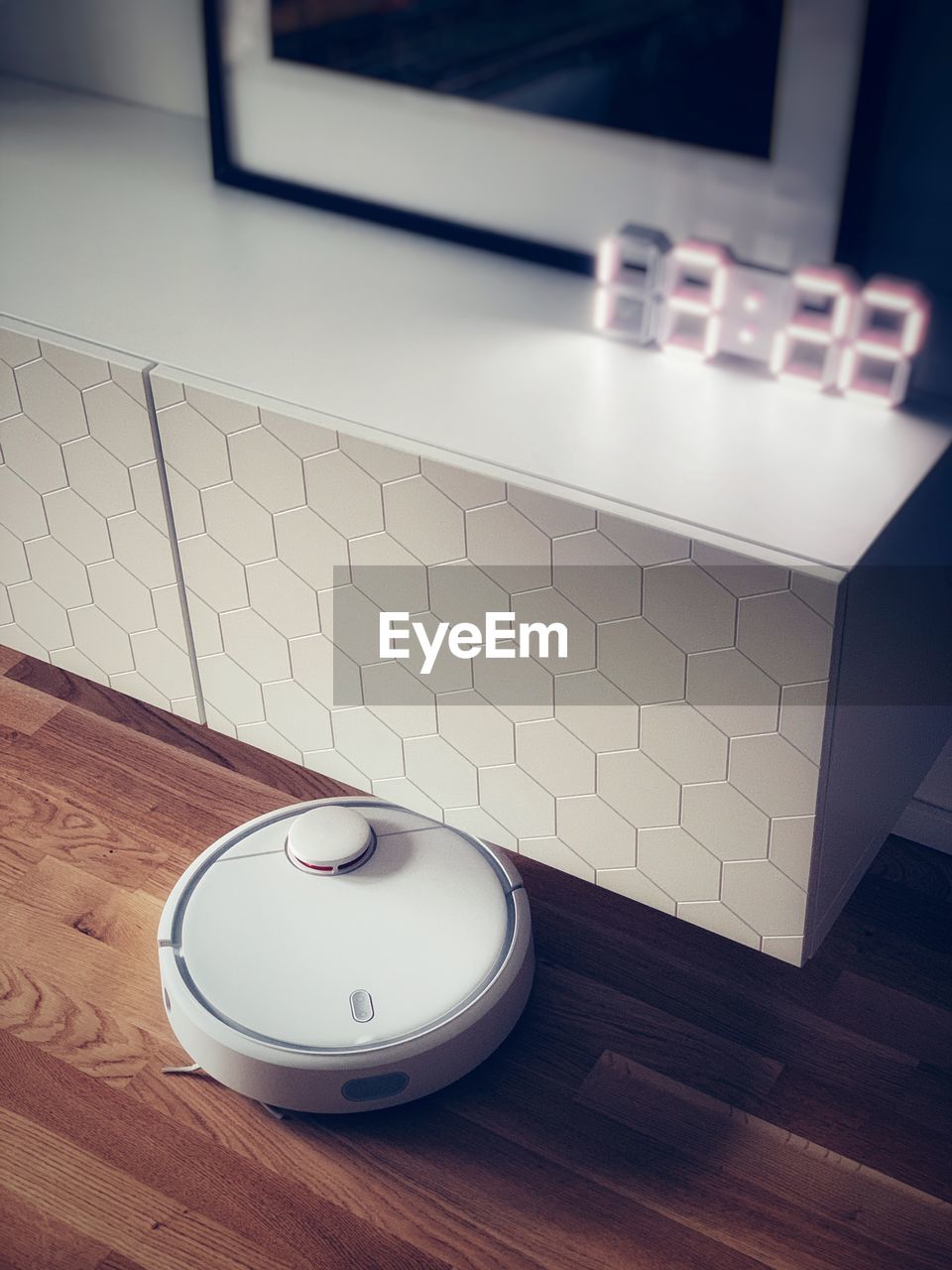 High angle view of robotic vacuum cleaner at home