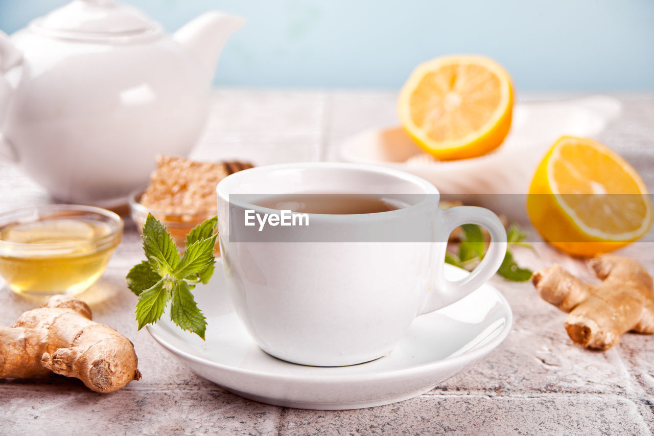 Refreshing ginger tea with lemon, mint leaf and honey