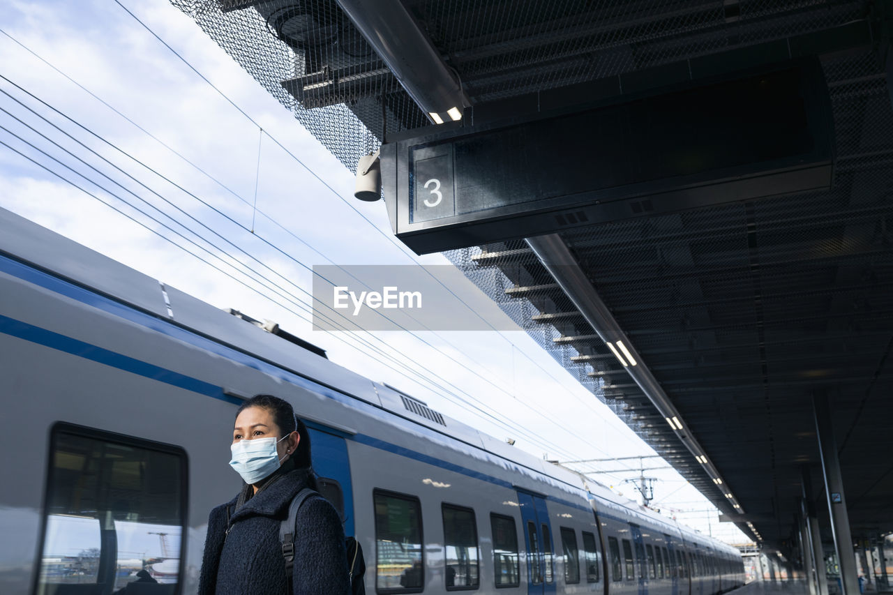 Woman on train station platform