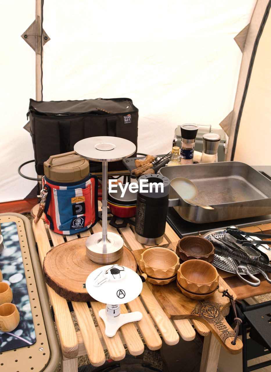 indoors, no people, room, kitchen utensil, drums, domestic room, household equipment, drum, gas stove, music, high angle view, large group of objects, kitchen, table, stove, food
