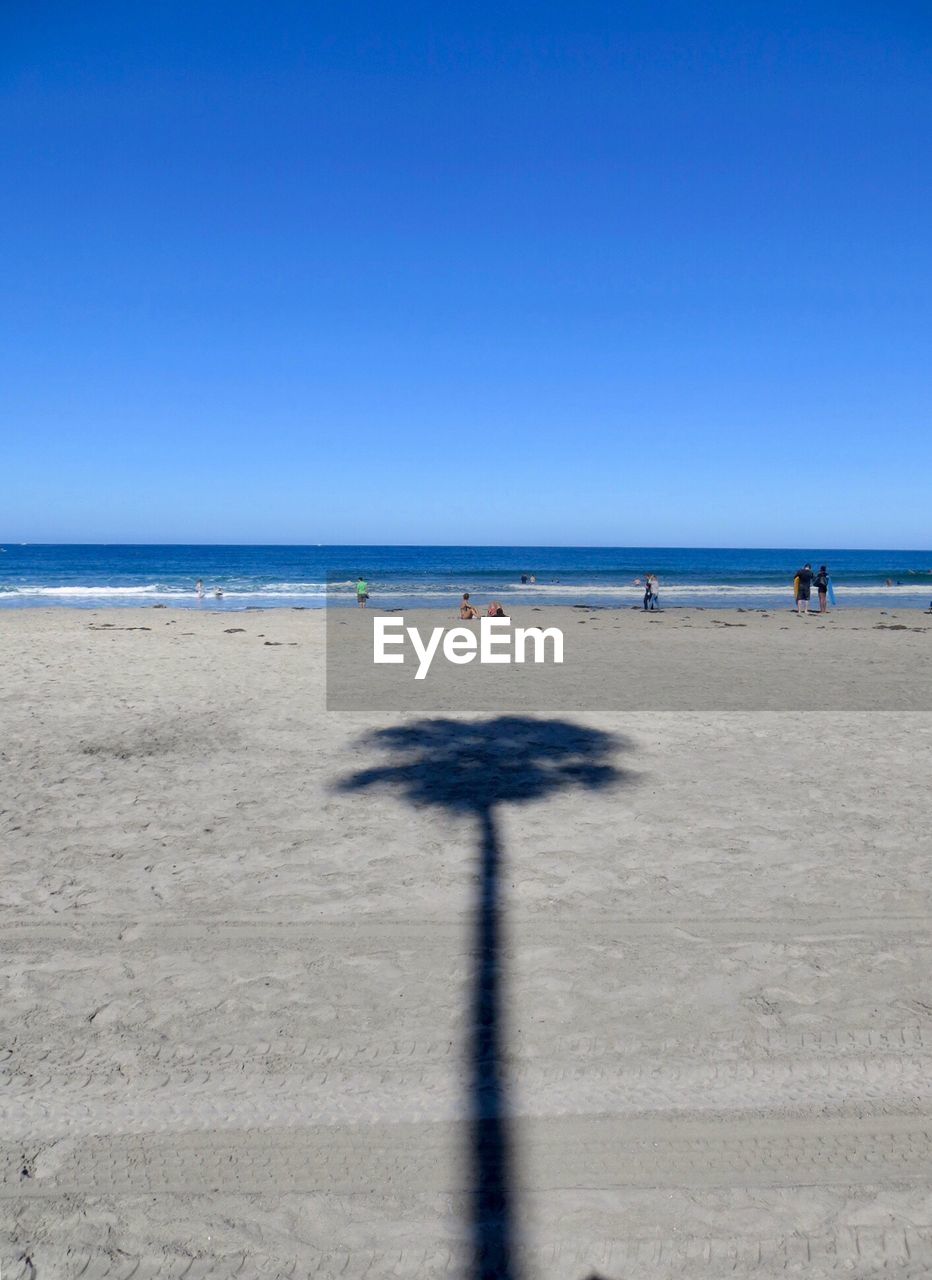 Scenic view of beach against clear sky