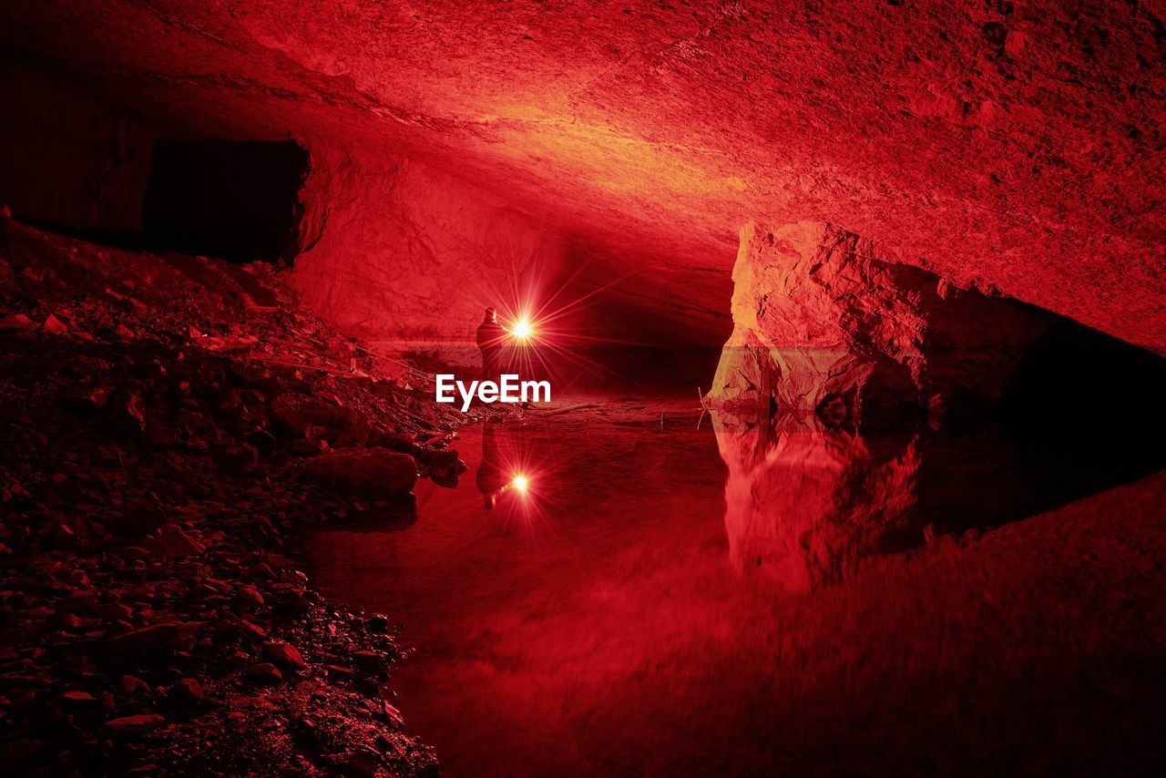 Person in illuminated cave