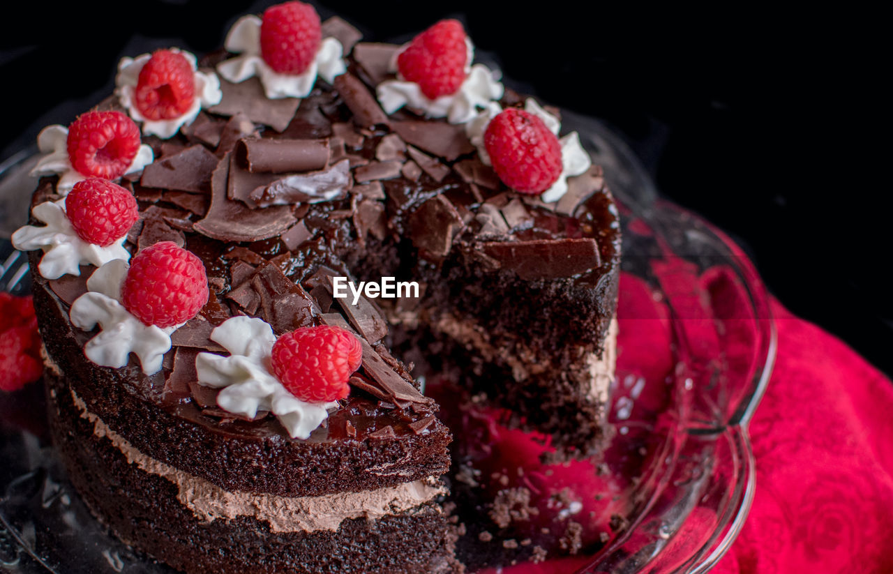 Decedent chocolate cake on a pretty glass cake stand