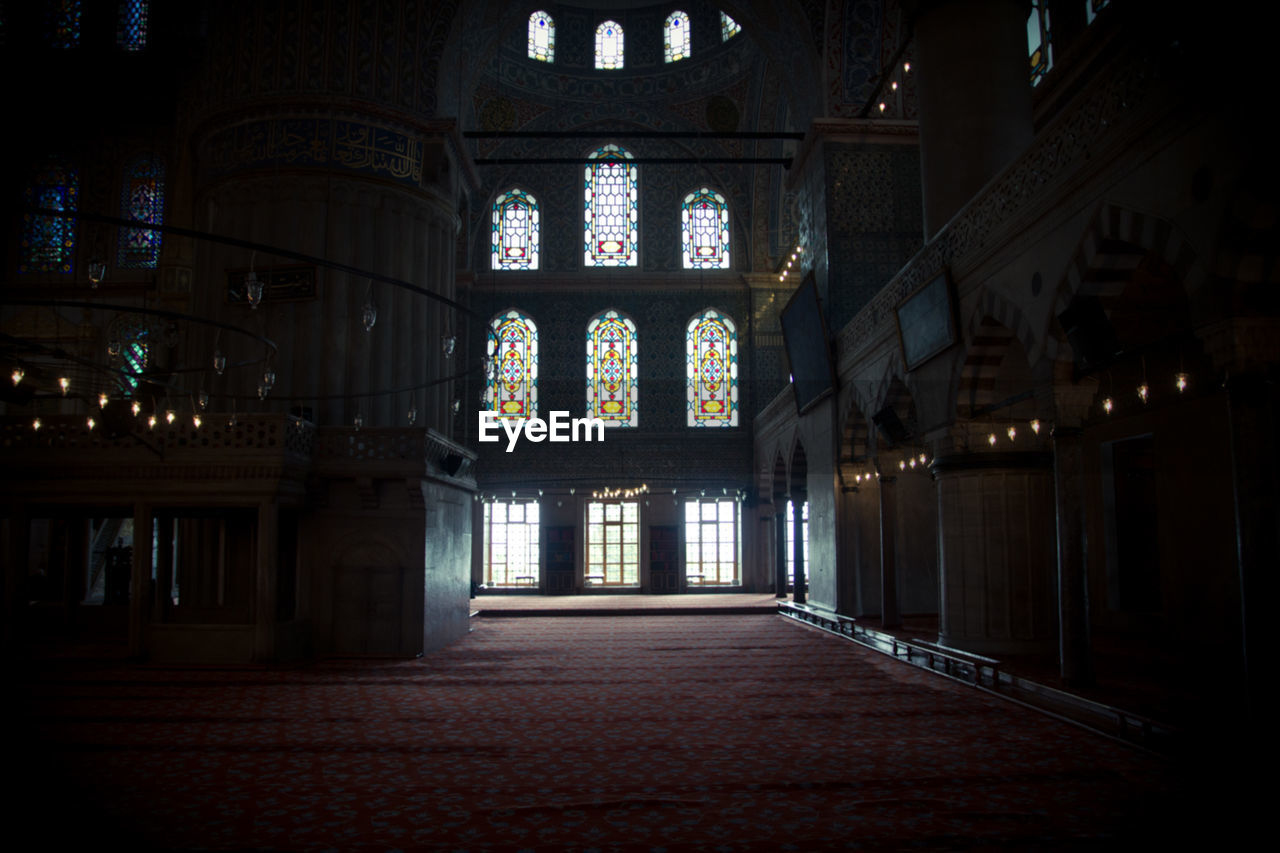 Empty flooring with stained glasses at church