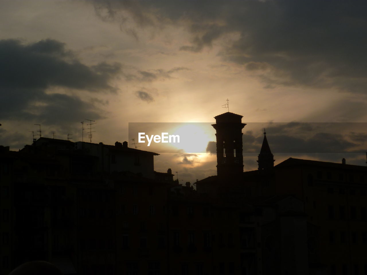 VIEW OF BUILDINGS AGAINST SUNSET SKY