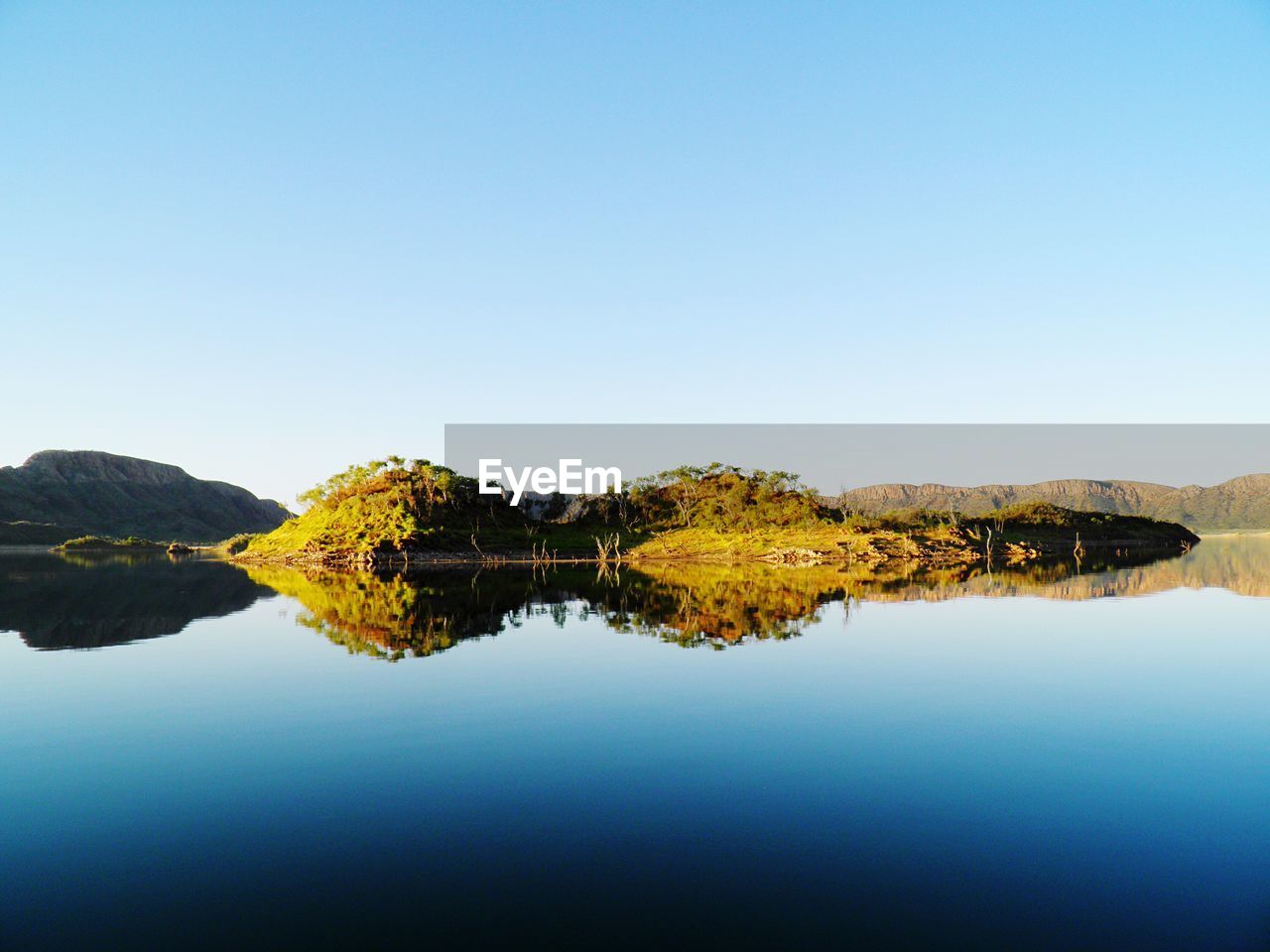 SCENIC VIEW OF LAKE AGAINST CLEAR BLUE SKY AND TREES