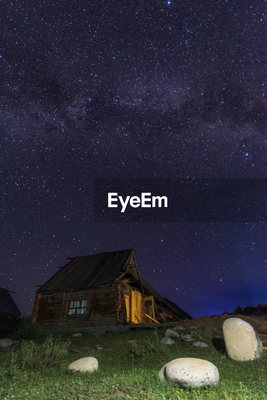 Scenic view of field against sky at night