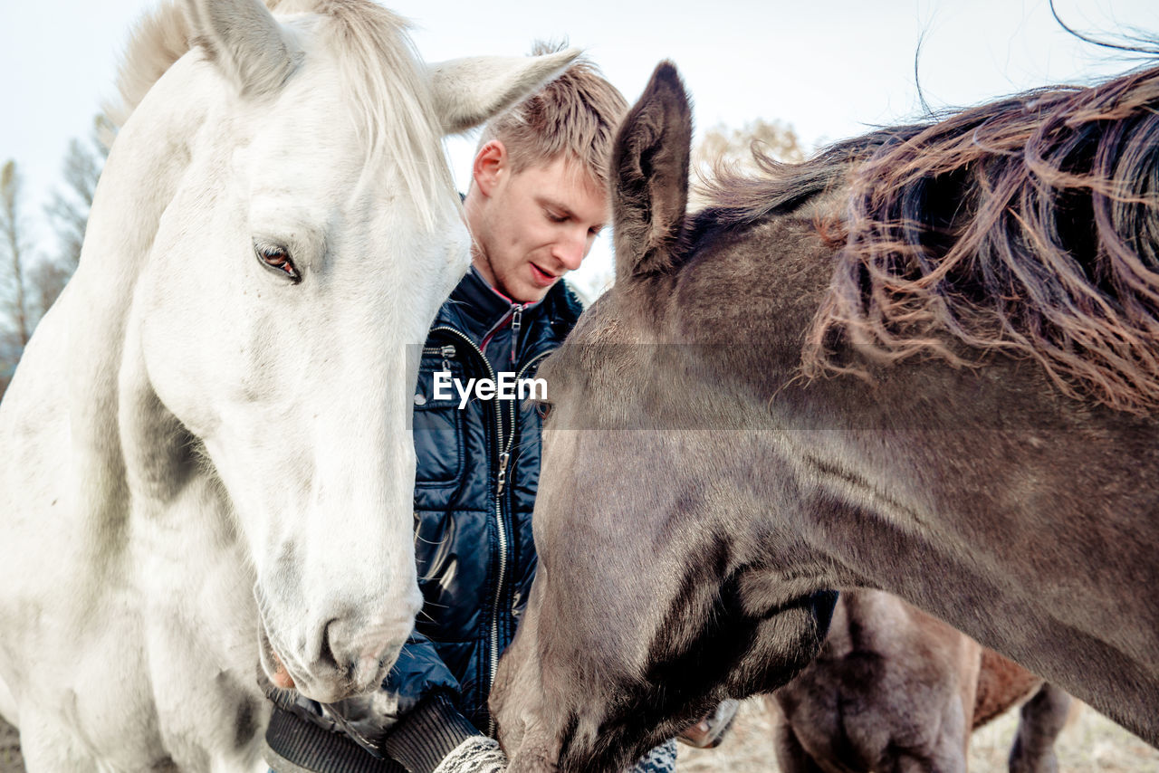 Close-up of man with horse