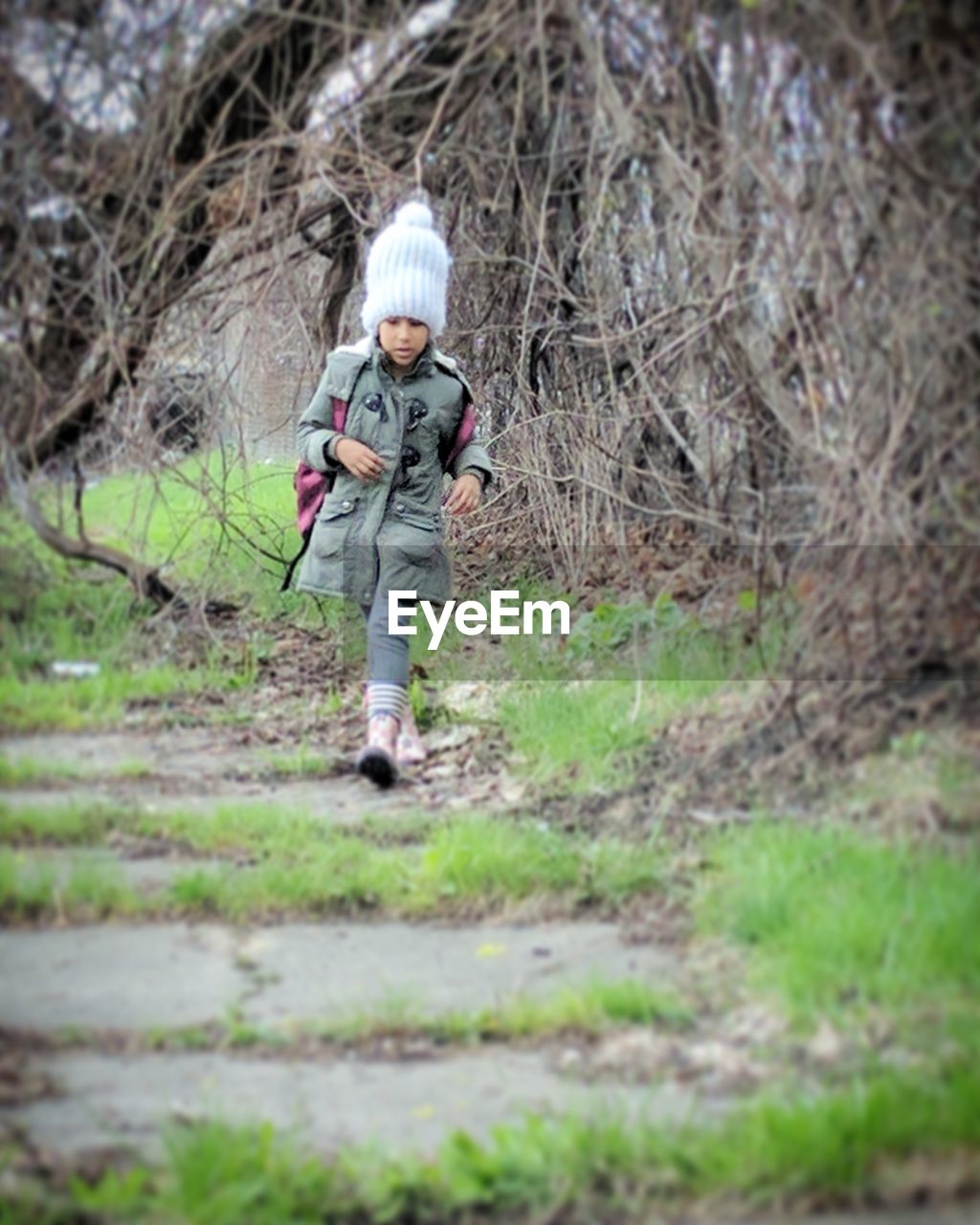 GIRL WALKING IN FOREST