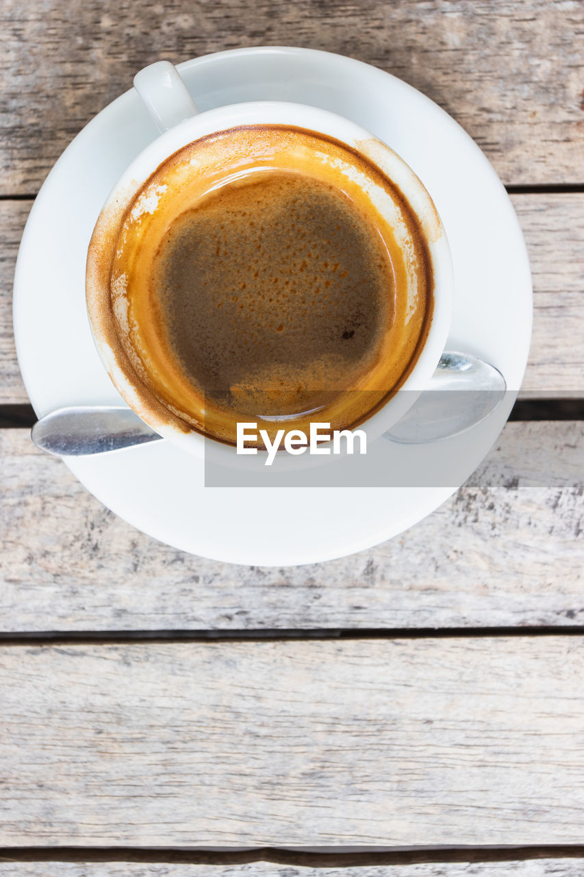 CLOSE-UP OF COFFEE CUP ON TABLE