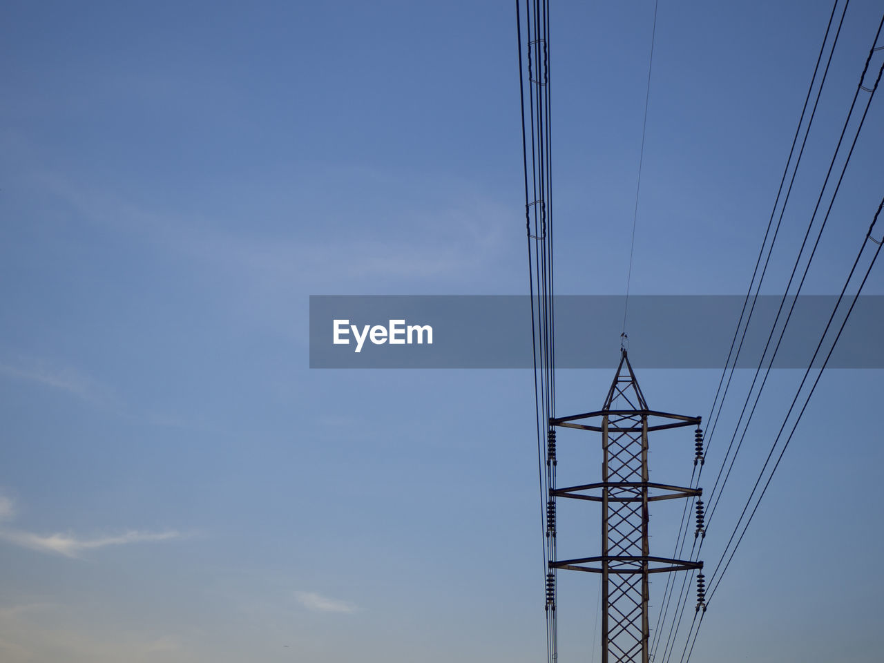 LOW ANGLE VIEW OF ELECTRICITY PYLONS AGAINST SKY