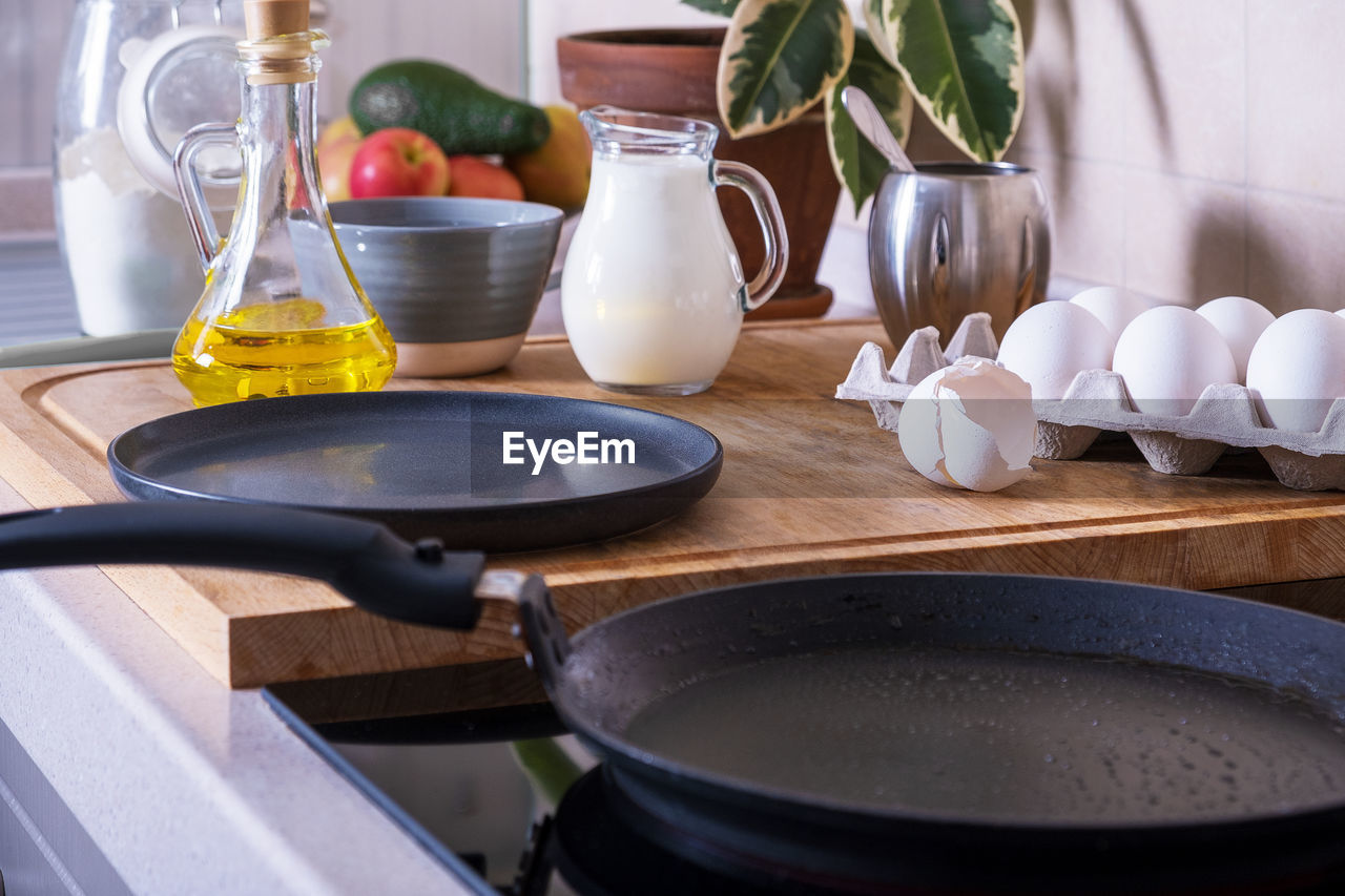 Workplace in the kitchen with ingredients and utensils for baking pancakes. home cooking food, diy