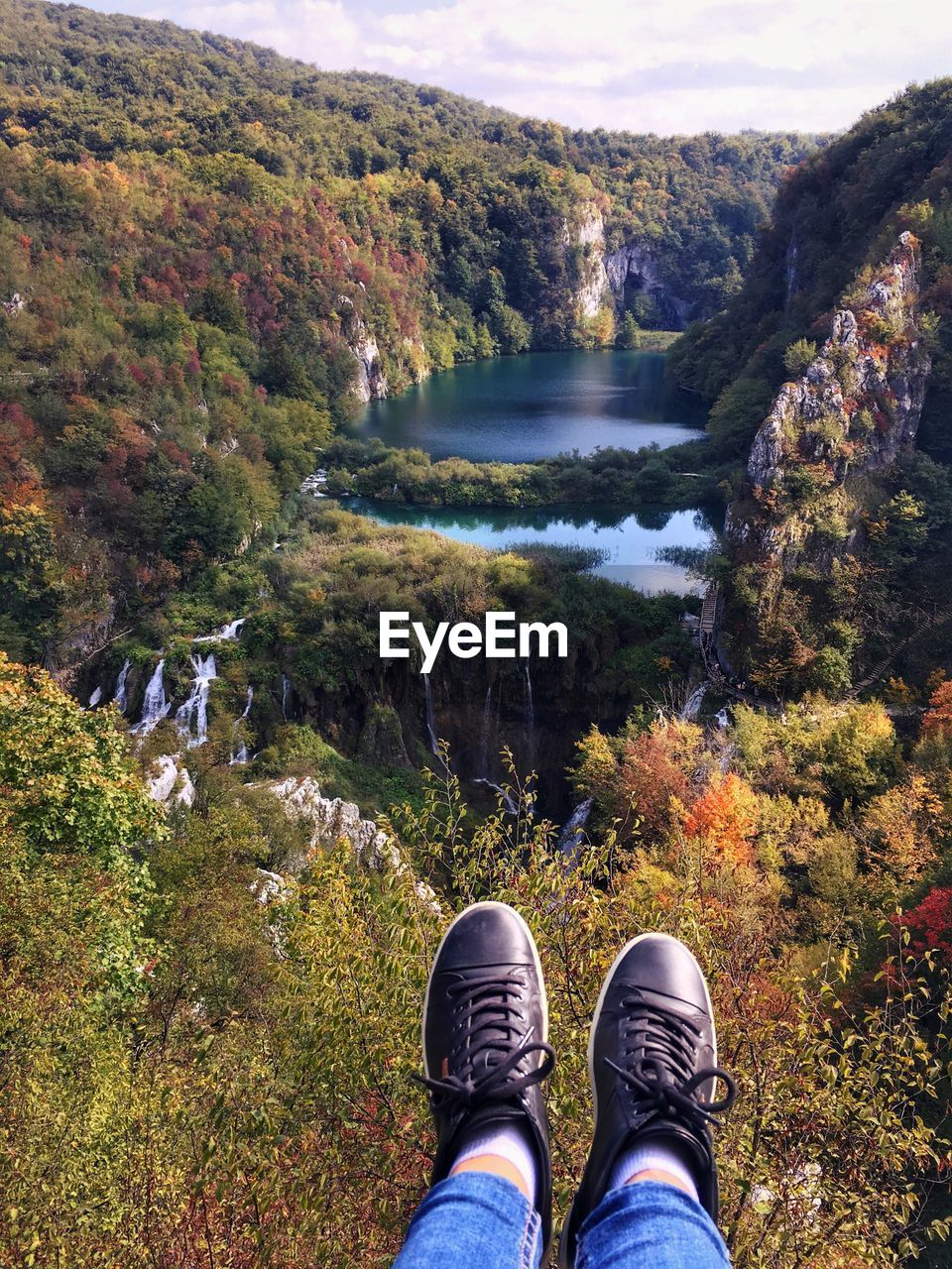 Low section of man over lake in mountain