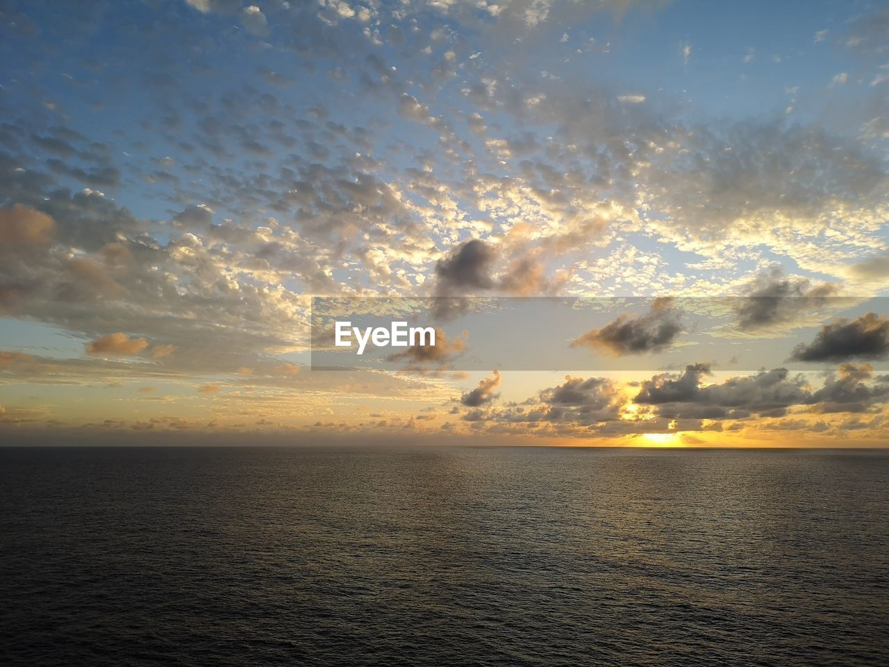 SEA AGAINST SKY DURING SUNSET