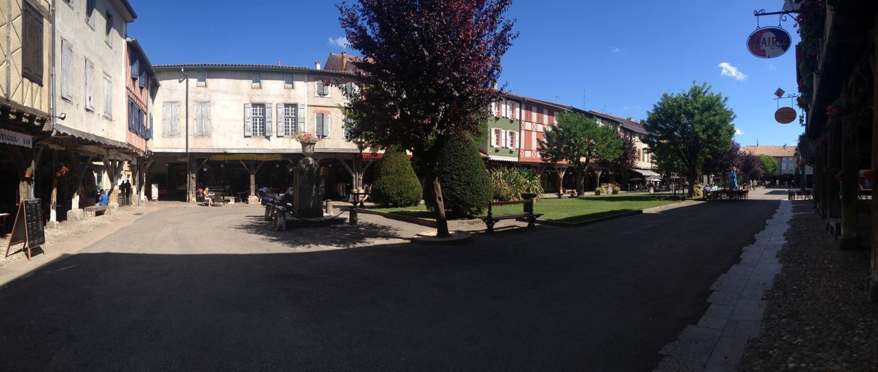 VIEW OF BUILDINGS AGAINST BLUE SKY